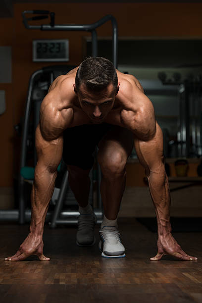 istock Strong Muscular Men Kneeling On The Floor 537018683