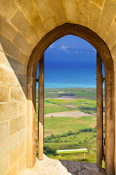 old wooden arch fortress with open doors landscape view