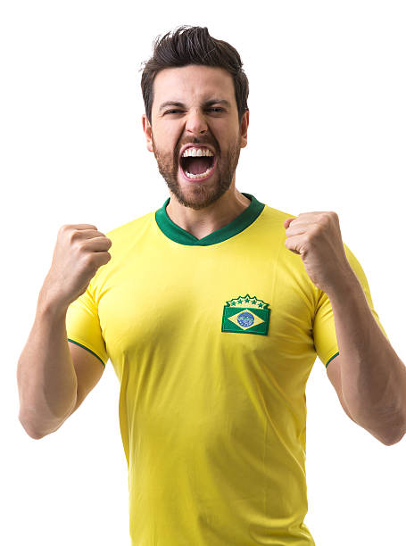 istock Brazilian young fan celebrating on white background 537039000