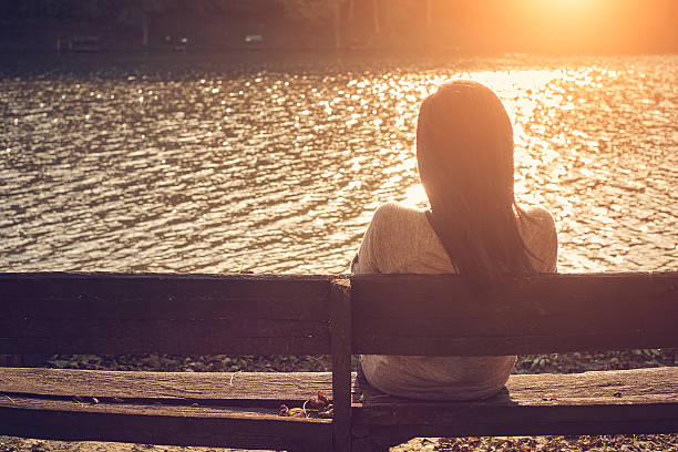 istock Woman sitting on bench 537041157