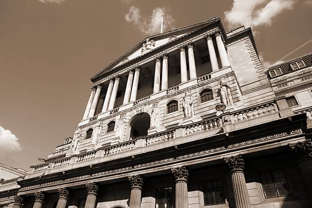 London sepia London, United Kingdom - Bank of England building. Sepia tone - filtered retro style monochrome photo. bank of england stock pictures, royalty-free photos & images