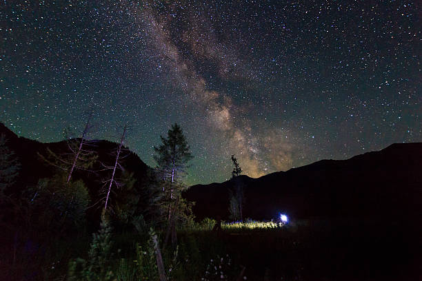 istock Amazing starry night in the high mountains with falling stars 537044257