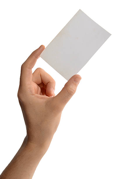 istock Female hand holding a businesscard 537046135