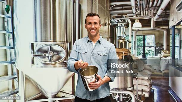 Smiling Brewmaster In Factory Stock Photo - Download Image Now - 2015, 30-34 Years, 30-39 Years