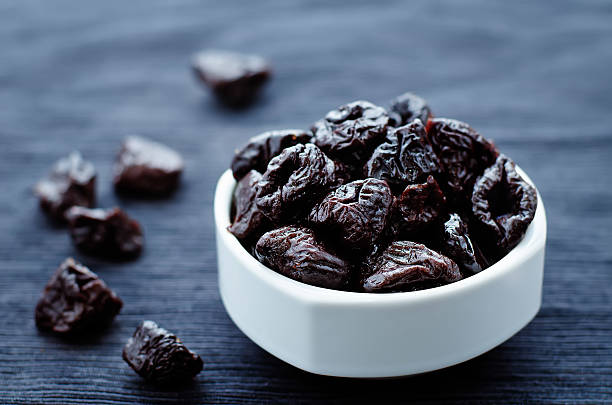 prunes in a bowl stock photo