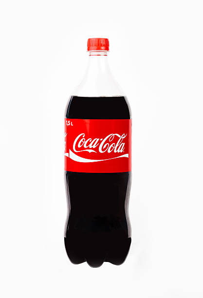 Plastic 1.5L bottle of Coca-Cola Trieste, Italy - April 14, 2016: Plastic 1.5L bottle of Coca-Cola . Isolated on white Background. Coca Cola, Coke is the most popular carbonated soft drink beverages sold around the world coke coal stock pictures, royalty-free photos & images