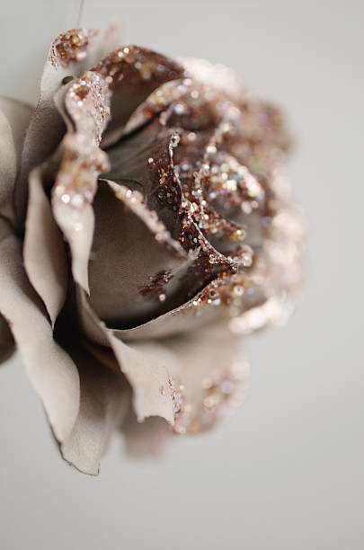 Beige textile flower with pearls, beads and glitters. stock photo