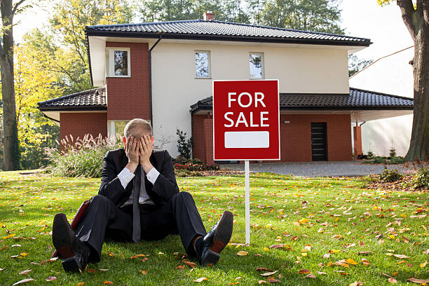 istock Estate agent sitting outside the house 537060258