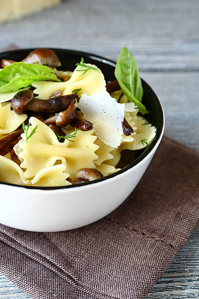 istock Farfalle pasta with mushrooms in a bowl 537060651