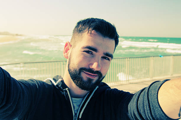 selfie portrait of young man outdoors