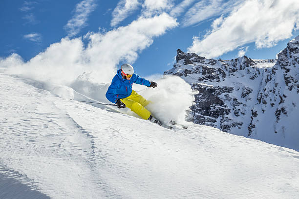 istock Skier skiing downhill in high mountains 537062855