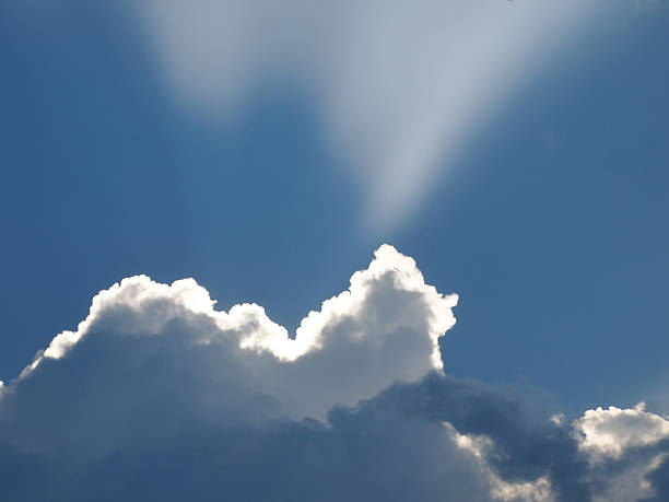 Cloud with Sunbeam stock photo