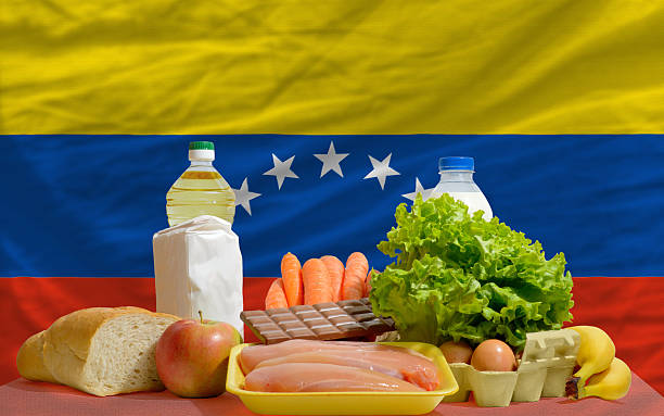 istock basic food groceries in front of venezuela national flag 537065549