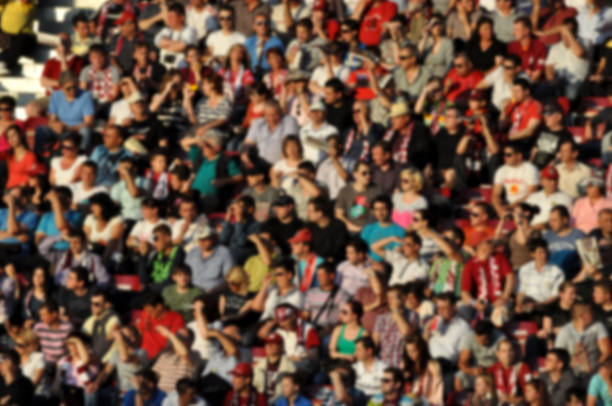 istock Crowd in a stadium. Blurred heads and faces of spectators 537066540