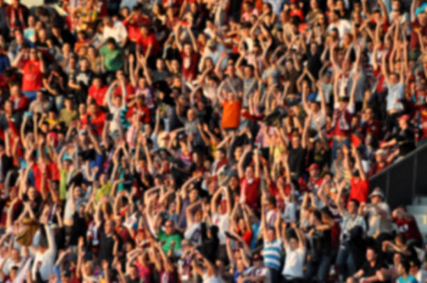 istock Crowd in a stadium. Blurred heads and faces of spectators 537067044