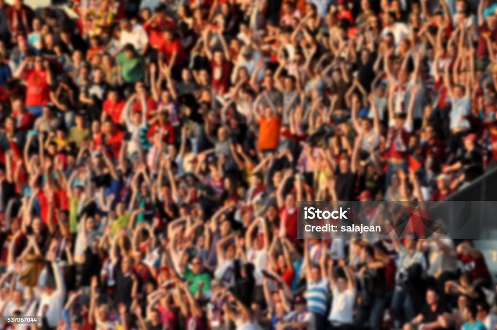 Crowd in a stadium. Blurred heads and faces of spectators Audience Stock Photo
