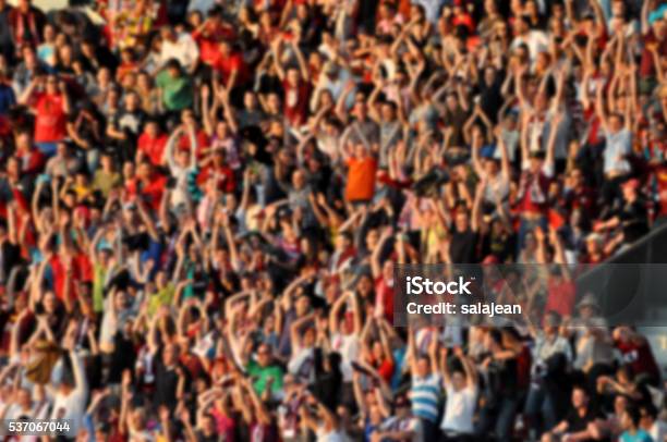 Crowd In A Stadium Blurred Heads And Faces Of Spectators Stock Photo - Download Image Now