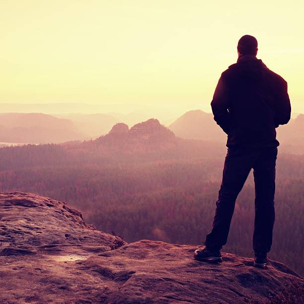 istock Silhouette of Man with Hands on Hips, Late Day Sun 537067298