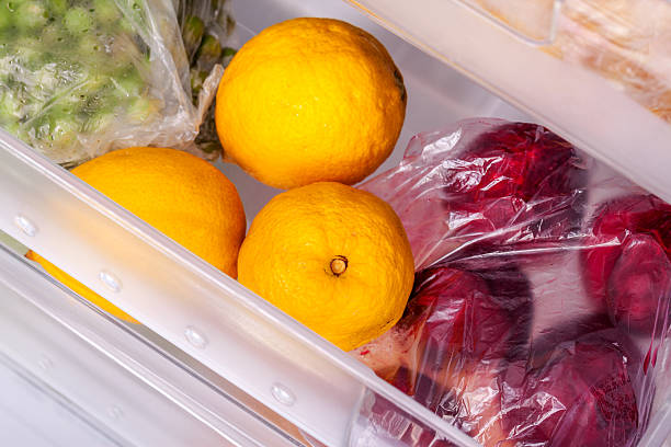 Freezer Four drawer freezer, full of fruit and vegetables in studio shot ice machines stock pictures, royalty-free photos & images