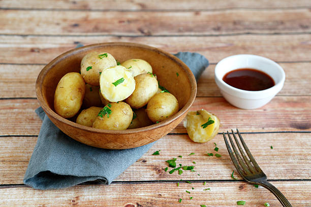 Tasty boiled potatoes in a clay bowl, food