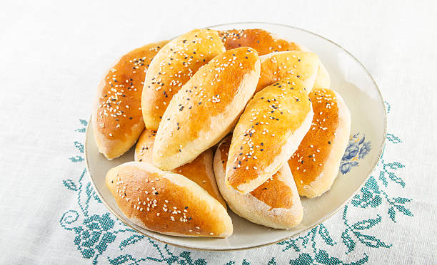 Russian and Ukrainian homemade pattys . Traditional Russian and Ukrainian homemade pattys with filling. brat burger stock pictures, royalty-free photos & images
