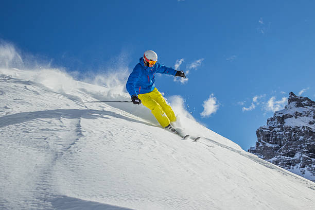 istock Skier skiing downhill in high mountains 537078239
