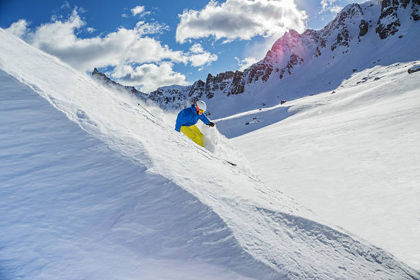 istock Skier skiing downhill in high mountains 537078241