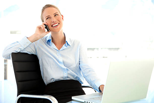 istock Young businesswoman on the phone at workplace 537080101