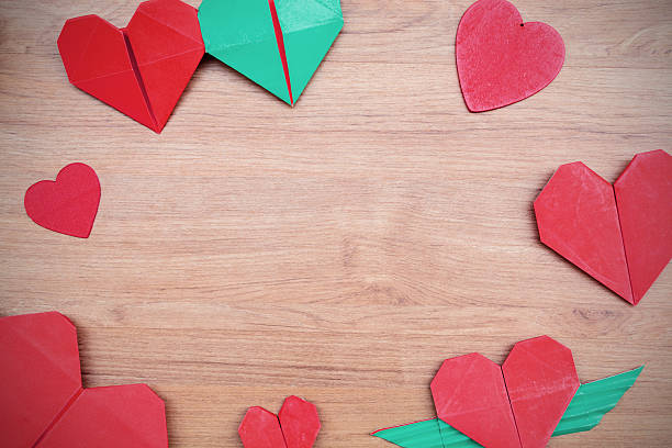 istock Red heart shape paper on wooden table 537080807