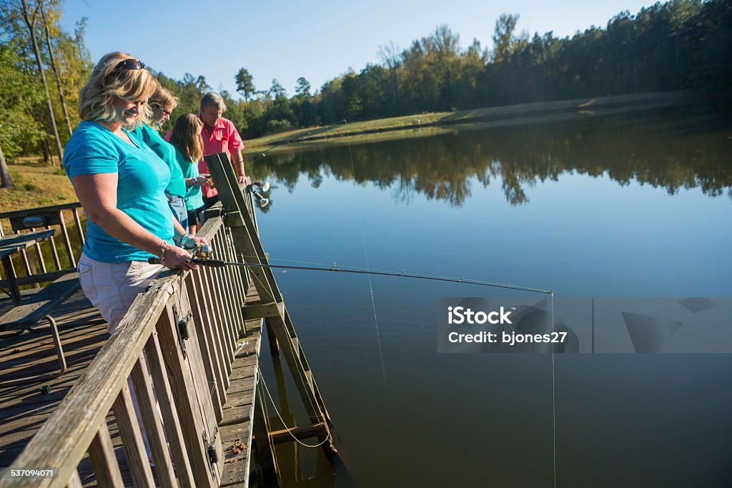 Fishing with Friends and Family group of people together on a fishing trip 2015 Stock Photo