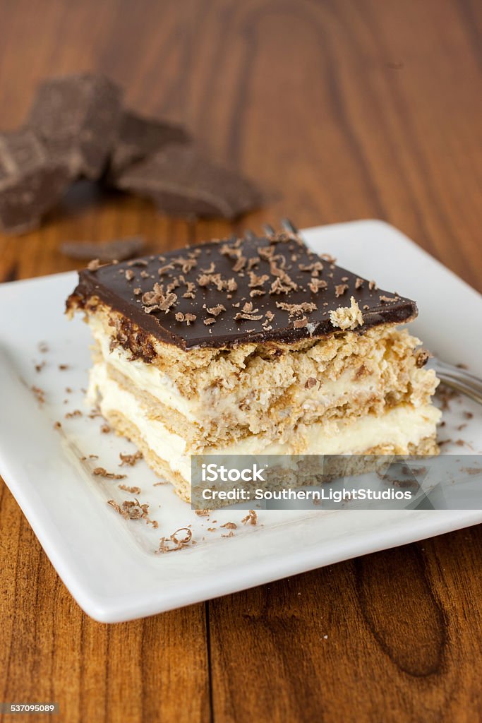 Boston Creme Pie Dessert A layered Boston creme pie style dessert made with french vanilla filling and chocolate ganache topping. 2015 Stock Photo
