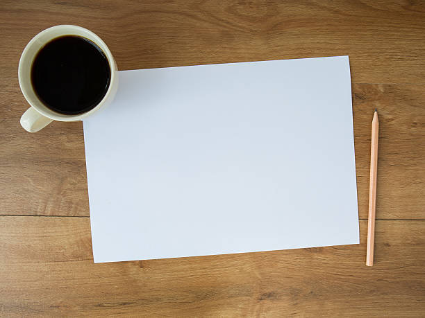 istock blank paper with coffee cup and pencil on wooden background 537095201