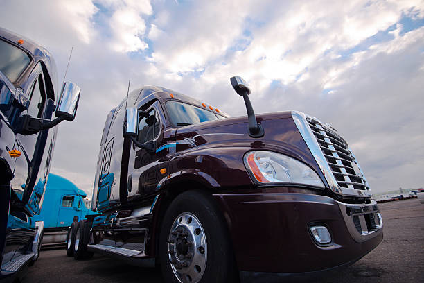 istock Big Rig semi trucks standing on trakstope background cloudy sky 537096371