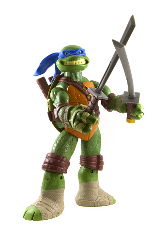 Vancouver, Canada - December 30, 2014 A Teenage Mutant Ninja Turtles toy isolated on white. They were made popular in the 80's and 90's and expanded into a cartoon series, films, video games and toys.