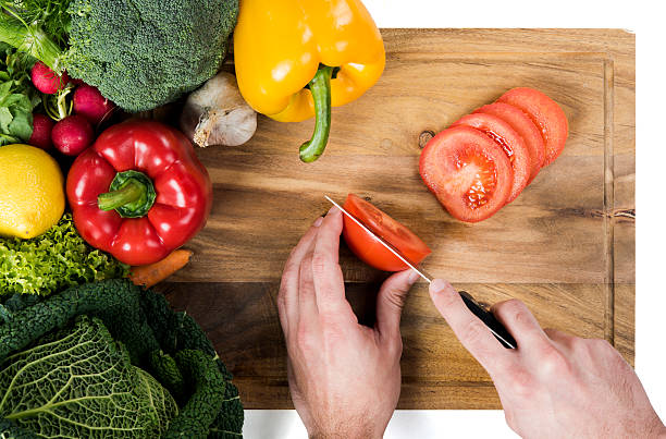 istock Cutting vegetables on wooden board 537097305