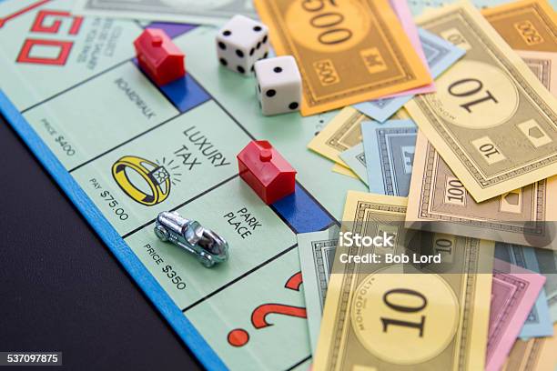 Monopoly Car On Park Place With Hotel Stock Photo - Download Image Now - Monopoly, Board Game, Leisure Games