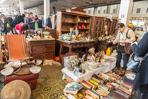 Barcelona, Spain - March 12, 2014: The most famous flea market in Barcelona, also known as Els Encants or Els Encants Vells, located in Glories neighborhood. Customers choosing and looking for something interesting