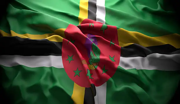 Dominica, Roseau official national state flag in black ambience with light coming from the top