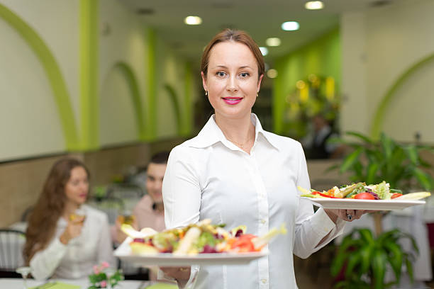 istock Female waiter serving guests table 537100915