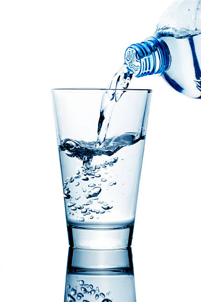 istock ouring water from bottle into glass 537114525