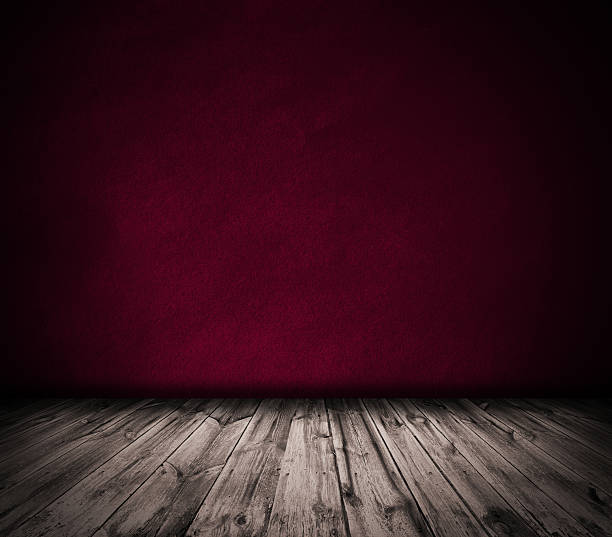 istock Red wall and wooden floor interior background 537115601
