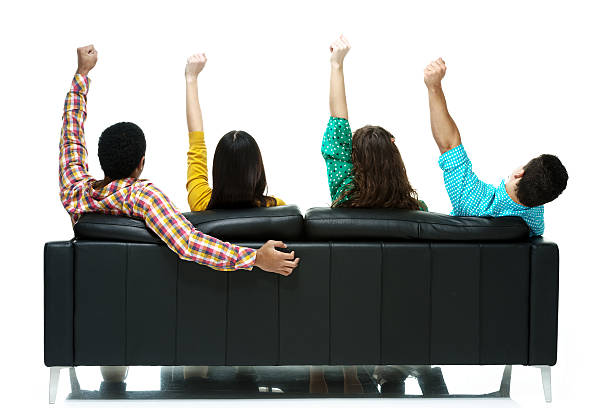istock Rear view of people on couch & cheering 537115683