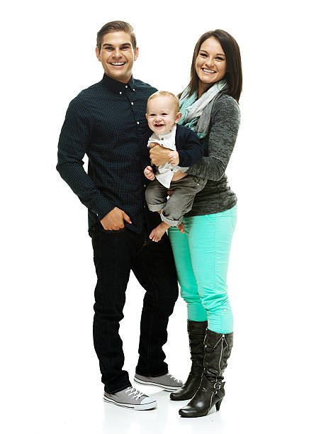 istock Happy young couple standing with their child 537115775