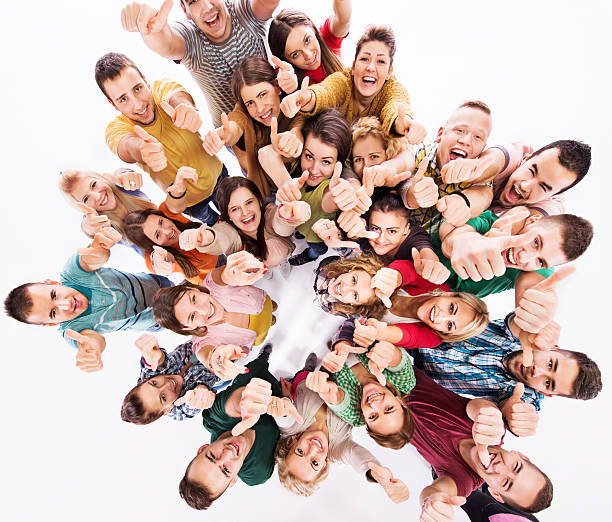 istock Cheerful young people showing thumbs up. 537115967