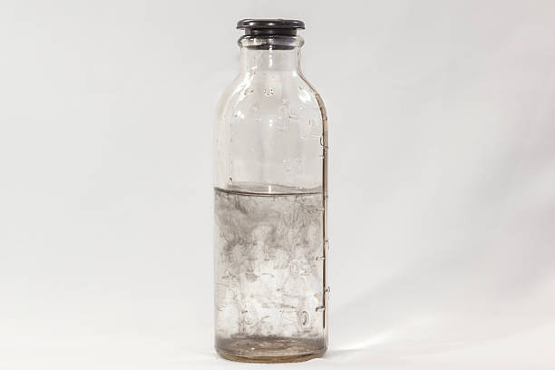 istock virus in a glass bottle on  white background 537116877