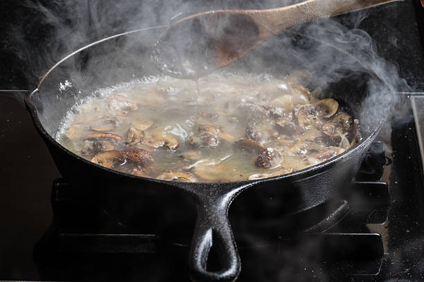 istock Sauteing sliced mushrooms in a skillet 537117021