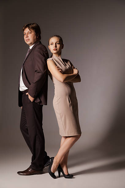 istock Business man and woman standing 537117653