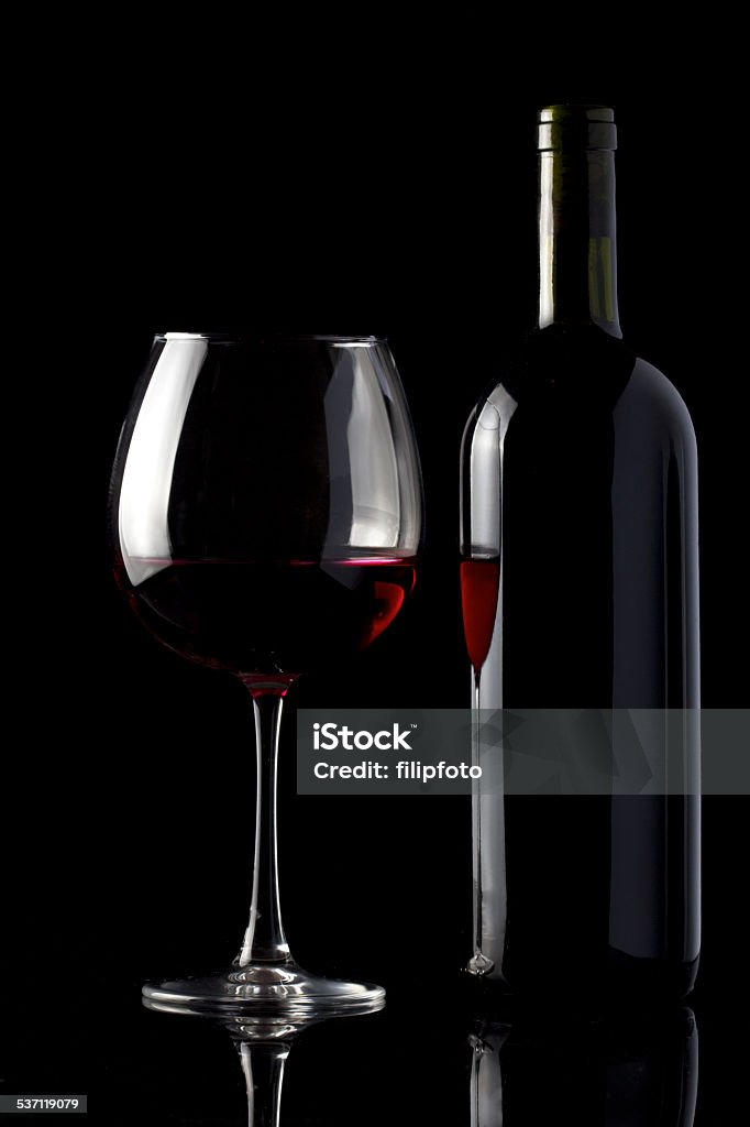 Glass and Bottle of Red Wine on Black 2015 Stock Photo