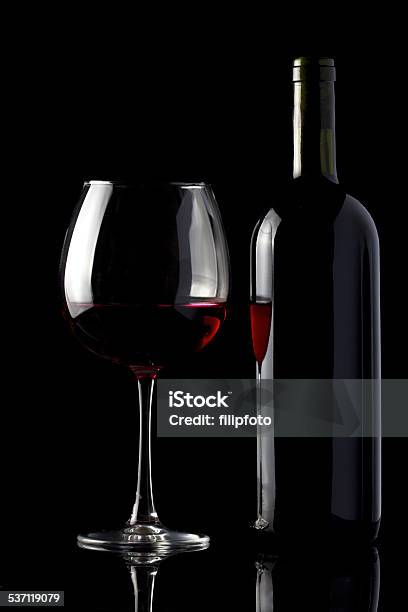 Glass And Bottle Of Red Wine On Black Stock Photo - Download Image Now - 2015, Alcohol - Drink, Black Background