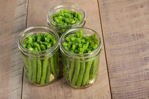 Fresh green beans in mason jars ready to be preserved